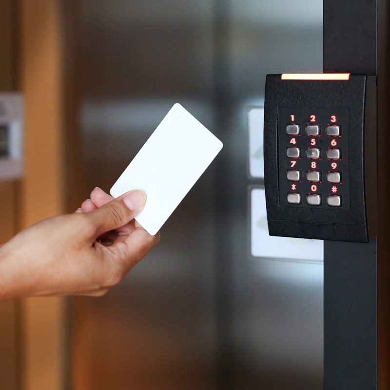 young-woman-holding-key-card-unlock-door